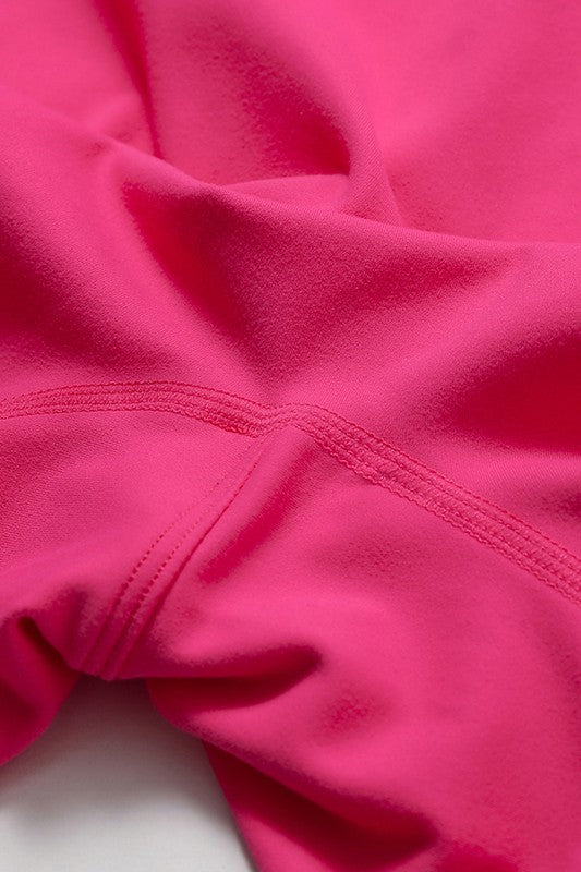 
                  
                    Close-up of pink fabric with a focus on texture and color.
                  
                