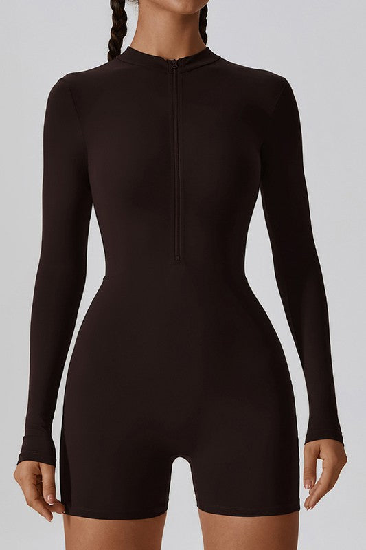 
                  
                    Black bodysuit worn by a model on a plain background
                  
                