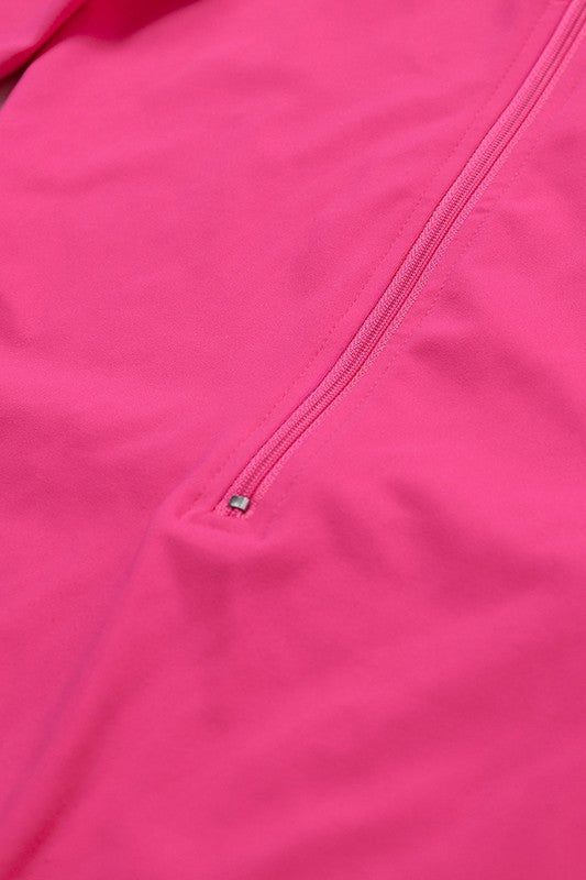 
                  
                    Close-up of a pink jacket with a zipper
                  
                