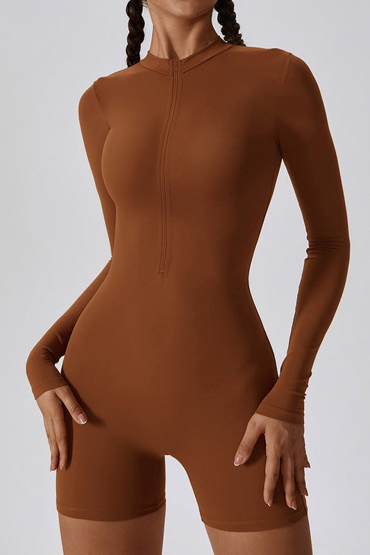 Brown bodysuit worn by a model on a light gray background