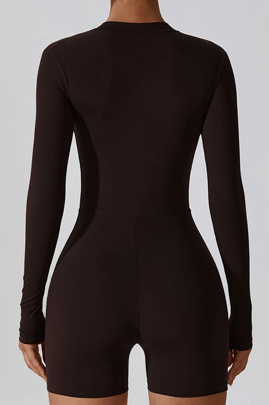 
                  
                    Black bodysuit worn by a person on a white background
                  
                