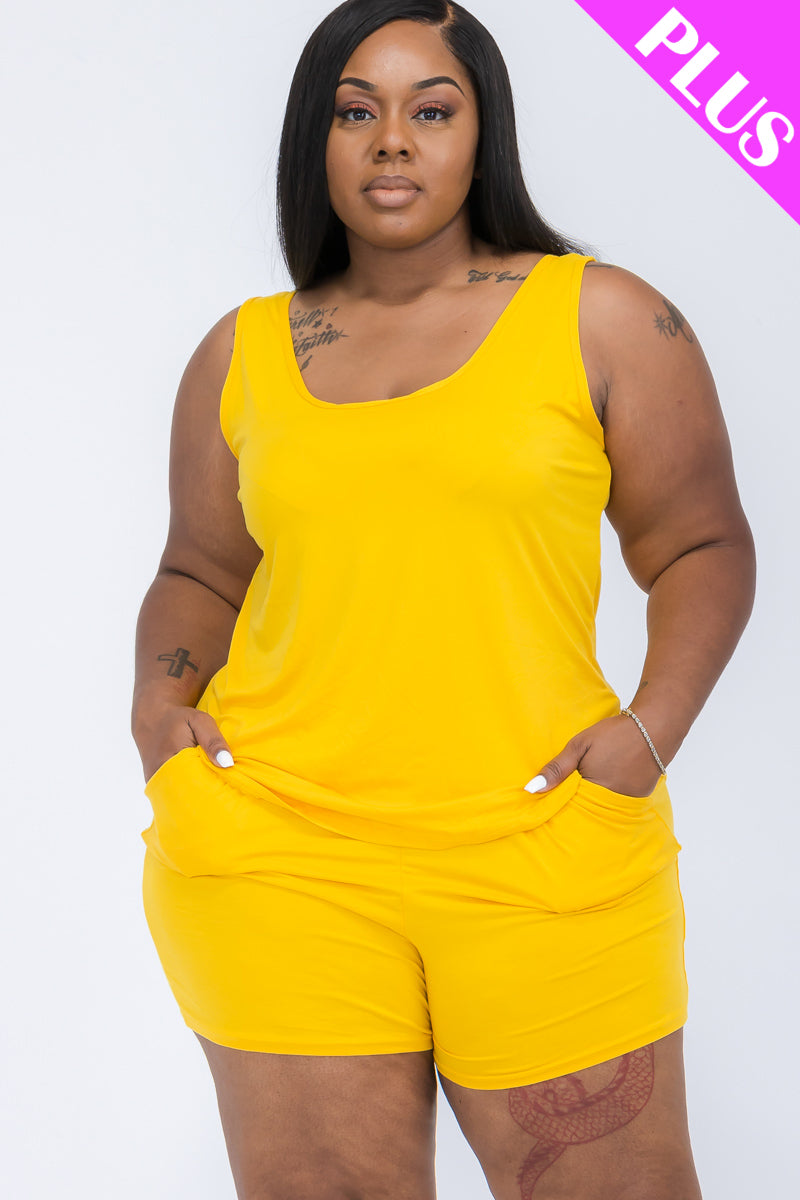 Woman wearing a yellow tank top and shorts set on a white background