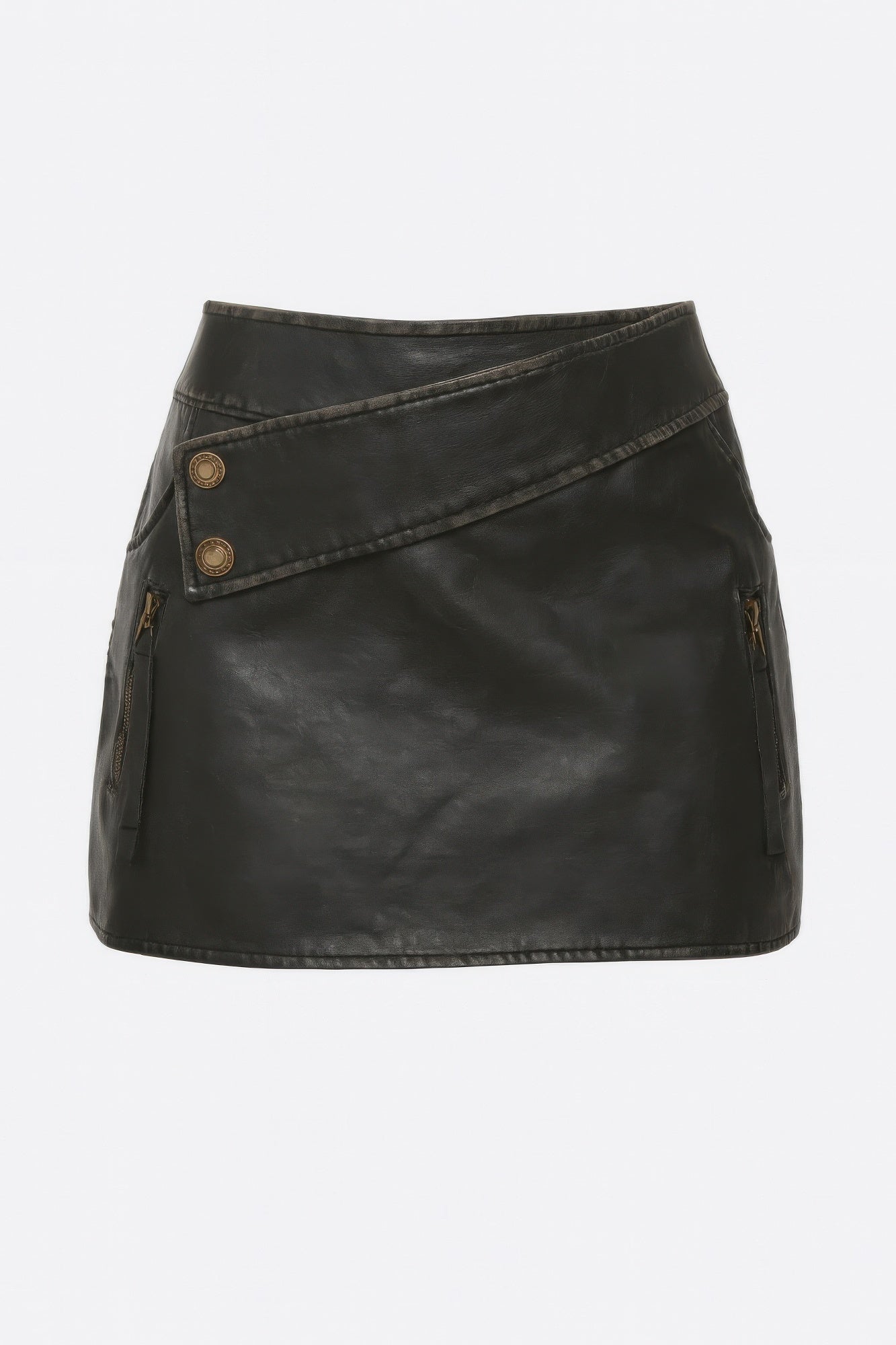 Studio product shot of a distressed black faux leather mini skirt with a slanted waistband, decorative buttons, and zipper pockets. Denver, Colorado USA.