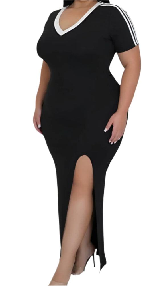 
                  
                     A full-length shot of a plus-size model wearing a black maxi dress with a V-neck and two white stripes on the short sleeves is shown. The dress is form-fitting and features a high slit on the left side. The model is wearing clear heeled sandals. The background is white.
                  
                