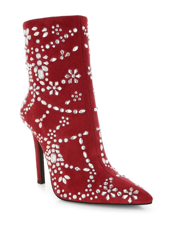 A front three-quarter view of the red microfiber ankle boot, showing the pointed toe and the dense floral-inspired pattern of diamante embellishments across the instep and toe area. Available from CO-Wear in Denver, Colorado USA.
