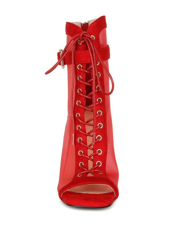 A straight-on front view of the red mesh stiletto bootie, highlighting the full lace-up front with gold eyelets, the red microfiber trim, and the open peep toe. Available from CO-Wear in Denver, Colorado USA.