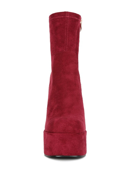 A straight-on front view of the deep red microfiber ankle boot, highlighting its tall shaft and the substantial, rounded platform sole. This boot is available from CO-Wear in Denver, Colorado USA.