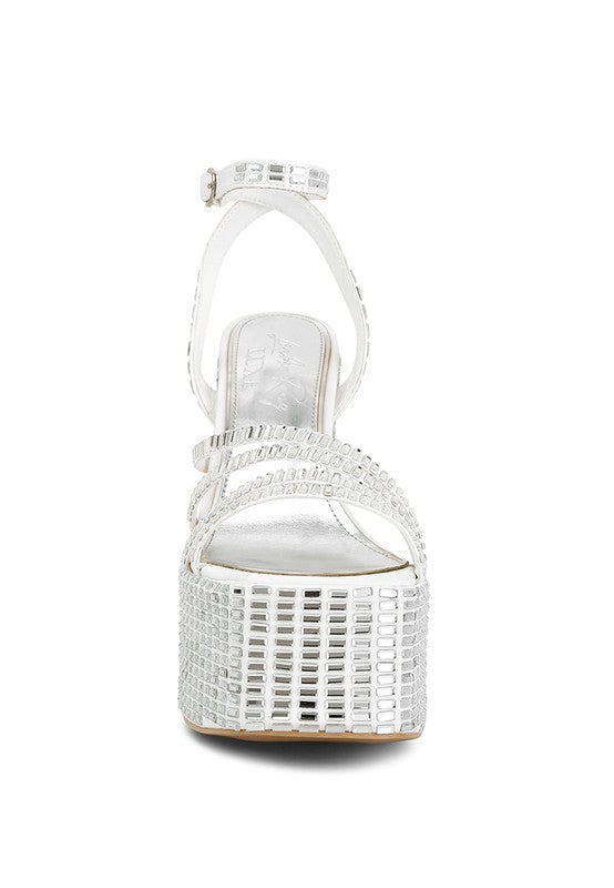A straight-on front view of the white platform sandal, showcasing the wide straps and the thick platform completely covered in square, mirror-like embellishments. Available from CO-Wear in Denver, Colorado USA.