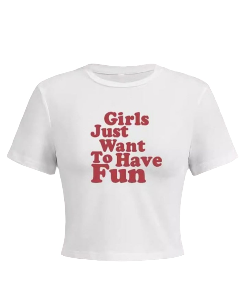 A white short-sleeve crop top is displayed on a mannequin. The front of the shirt features red text that reads "Girls Just Want To Have Fun". The background is solid white.
