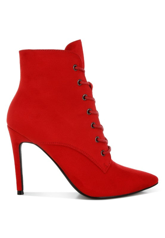 A side profile of a vivid red microfiber ankle boot, featuring a slim stiletto heel and a pointed toe, with a lace-up detail running down the front. This boot is available from CO-Wear in Denver, Colorado USA.