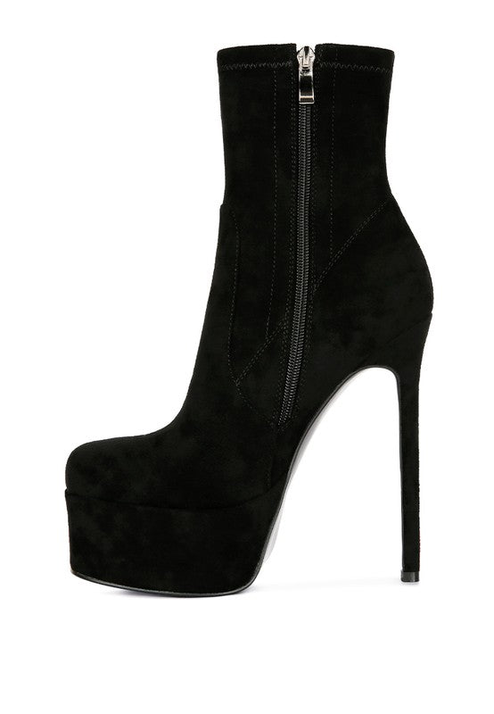 A side profile of a black microfiber ankle boot, emphasizing the high stiletto heel, thick platform, and the full-length silver zipper closure on the side. This boot is available from CO-Wear in Denver, Colorado USA.