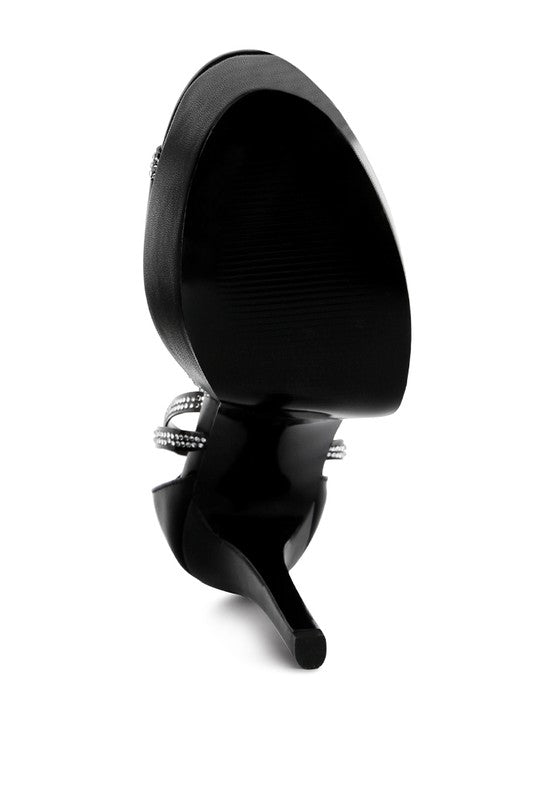 A bottom view detail of the black stiletto platform sandal, focusing on the textured sole and the narrow rubber heel tip. This shoe is available from CO-Wear in Denver, Colorado USA.