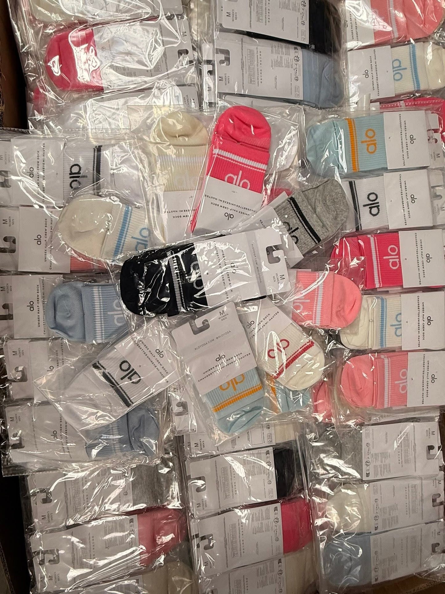 Stacks of ink cartridges with visible brand labels in a pile.