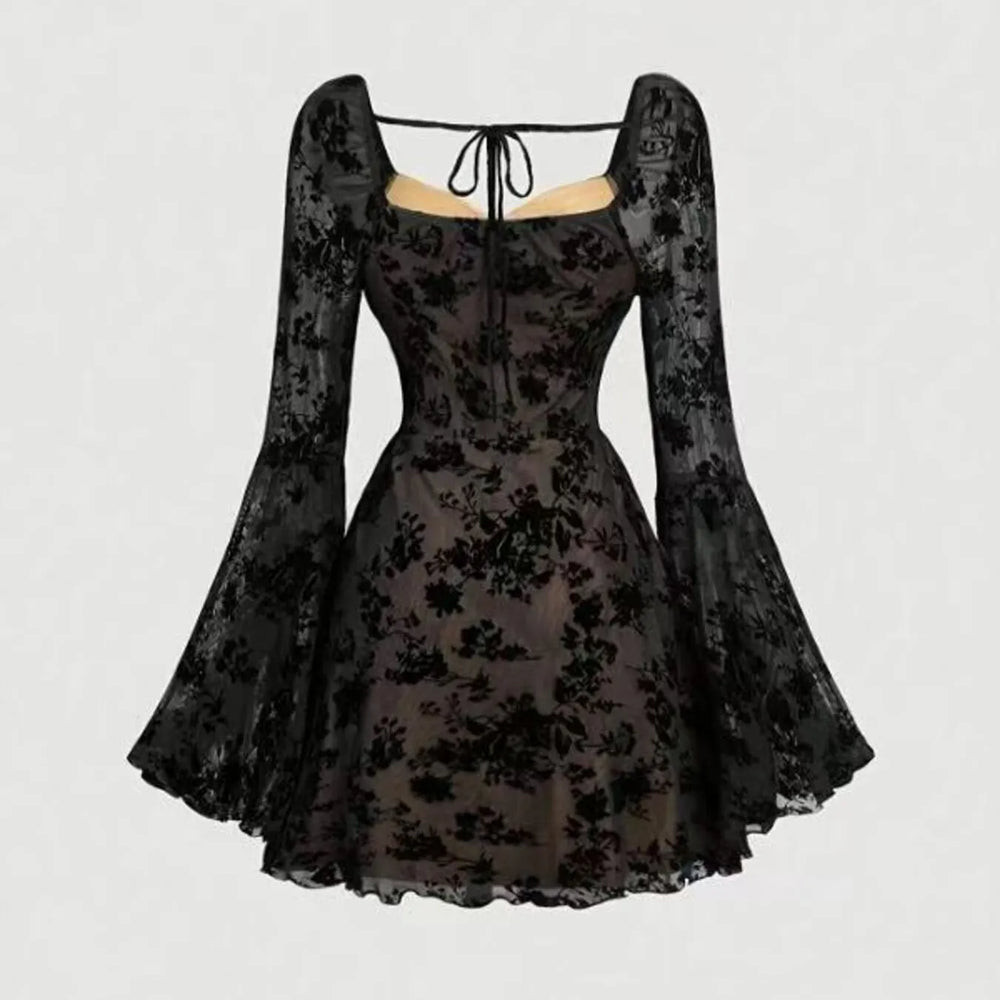 Black lace dress with long sleeves on a light gray background