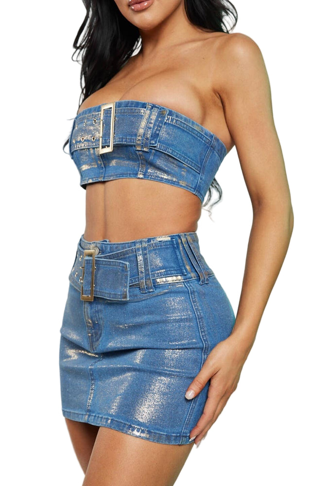 Woman wearing a denim strapless top and skirt on a light gray background