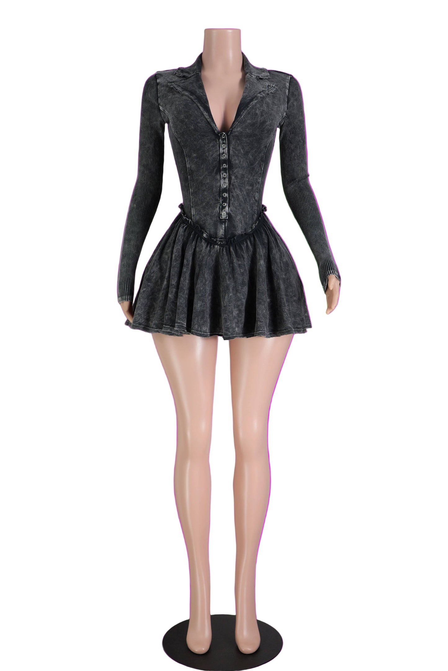 Mannequin wearing a black pleated dress against a pink background