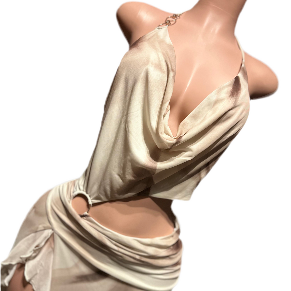 
                  
                    Mannequin wearing a beige draped dress on a white background
                  
                