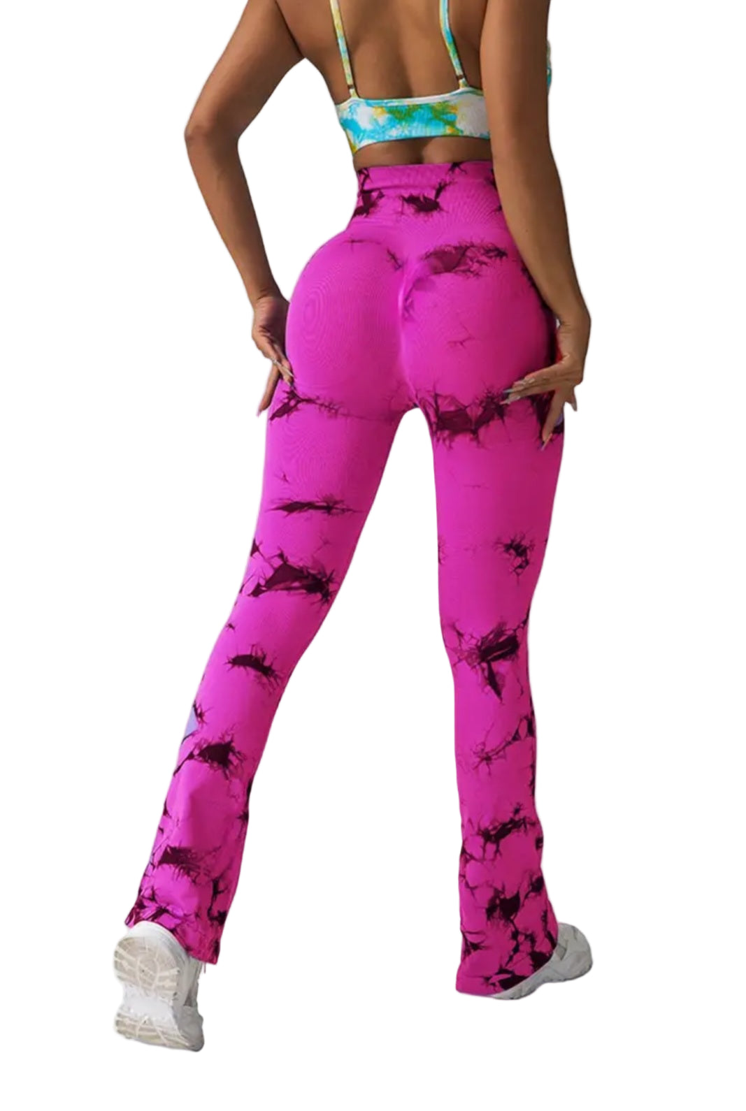 Person wearing pink tie-dye leggings on a plain background